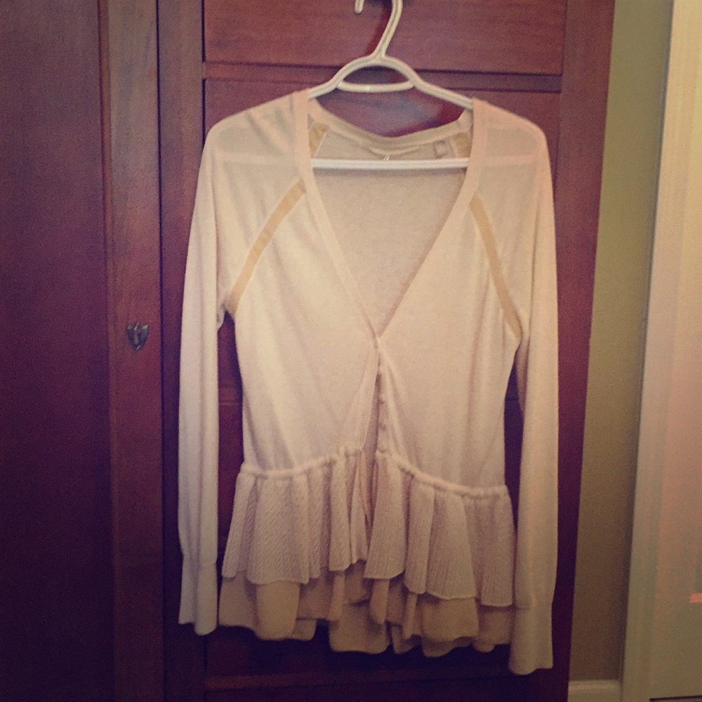 Knitted and knotted cardigan size medium.